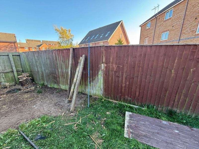 Feather edge fencing along a rear garden boundary in Brymbo, Wrexham