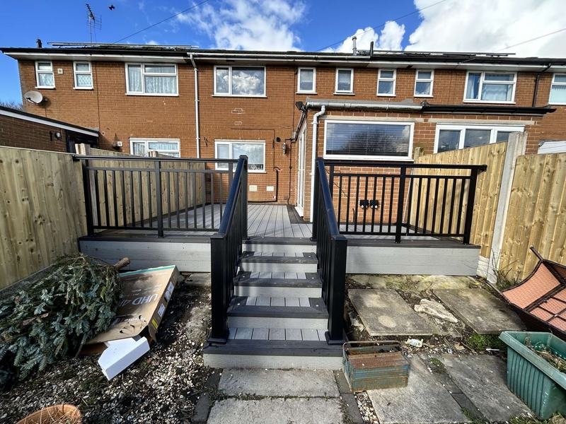 Composite decking with aluminium balustrades and steps down to the garden in Tan-y-Fron, Wrexham