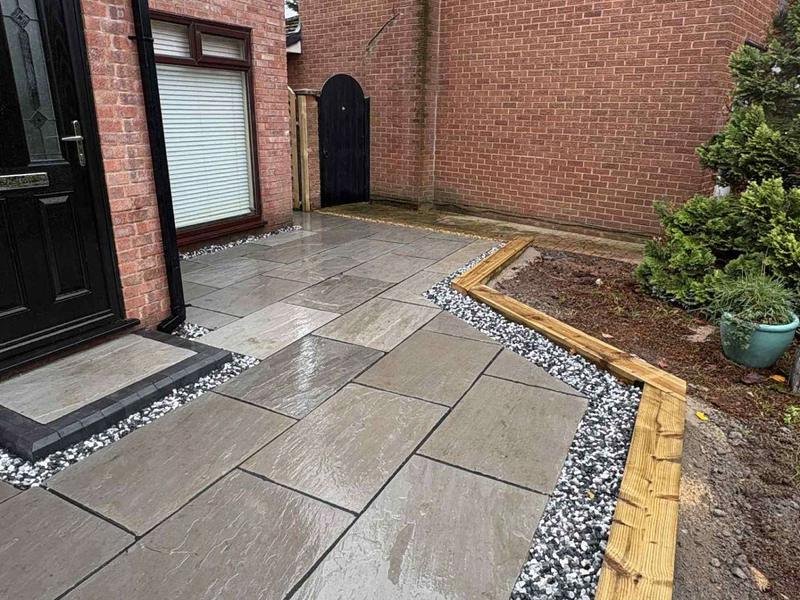 Kandla grey Indian stone path with a pebble border after a full garden renovation in Bersham, Wrexham