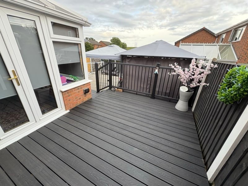 Charcoal composite decking with a matching balustrade and gazebo in Abenbury, Wrexham