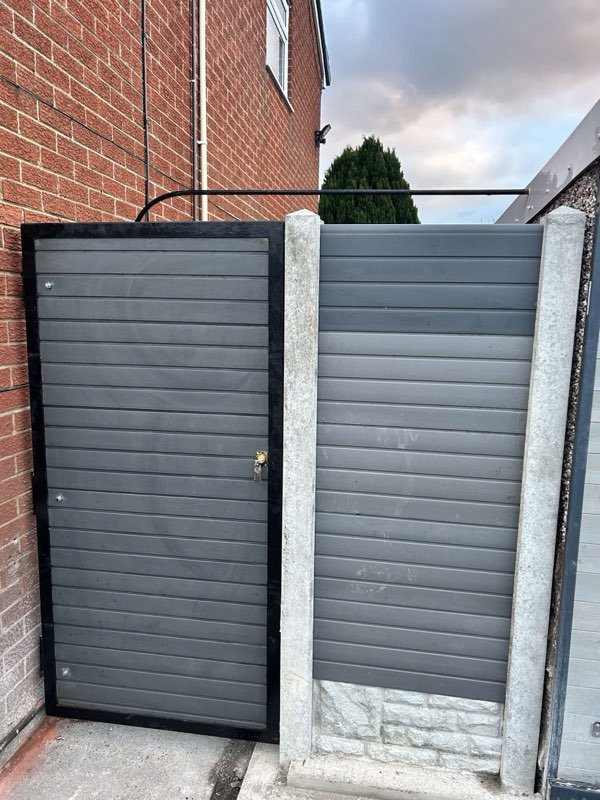 Grey composite fence panels and a steel-framed bespoke gate in Pen-y-Cae, Wrexham