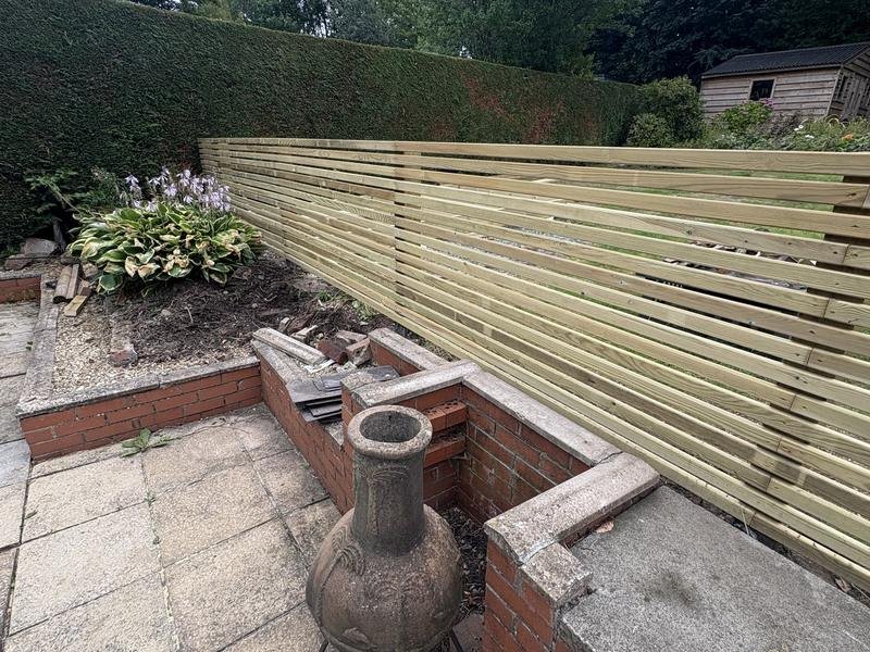 Contemporary slatted timber fence with 15mm gaps installed in Summerhill, Wrexham