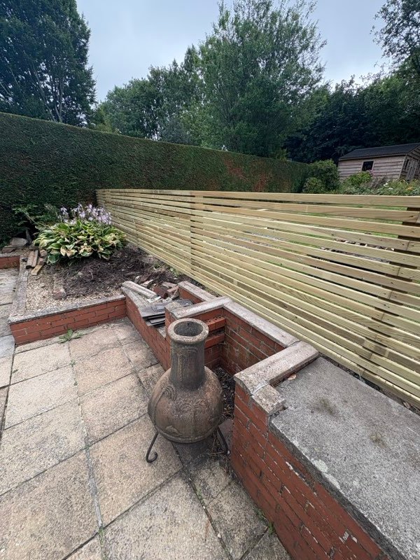 Contemporary slatted timber fence with 15mm gaps installed in Summerhill, Wrexham