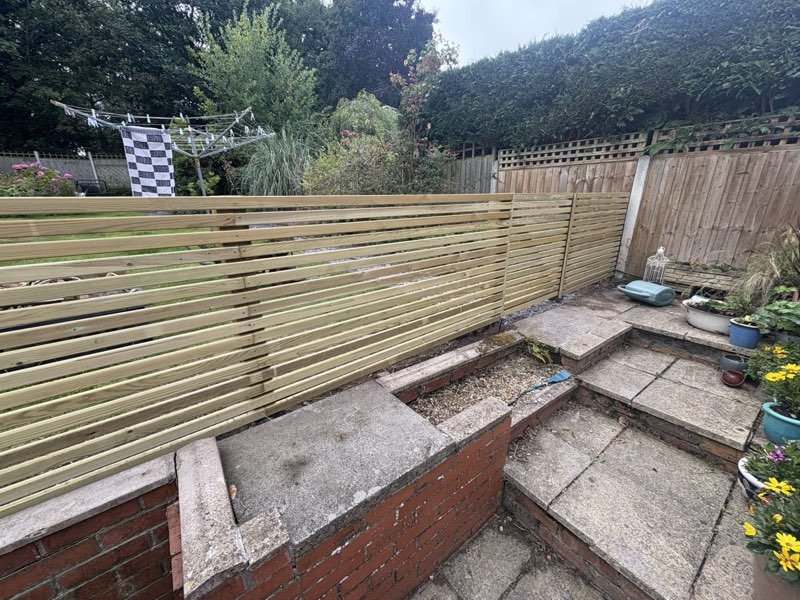 Contemporary slatted timber fence with 15mm gaps installed in Summerhill, Wrexham