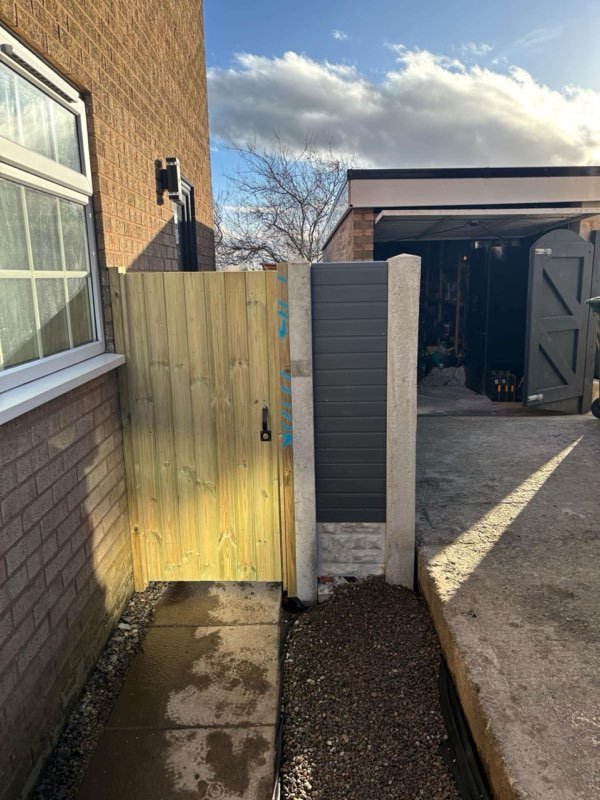 Fence extension and a new timber gate securing a side passage in Coedpoeth, Wrexham