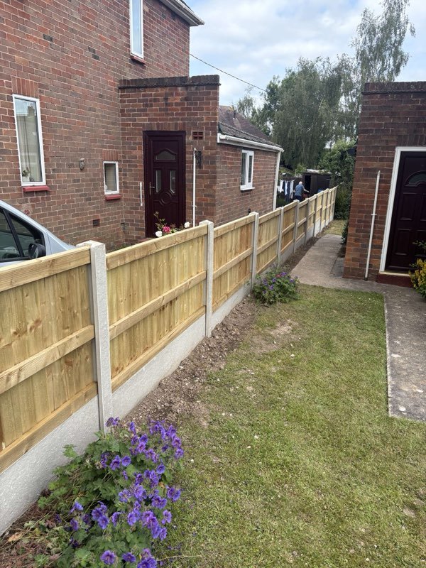 Feather edge fence panels on concrete posts and gravel boards in Ellesmere, Shropshire