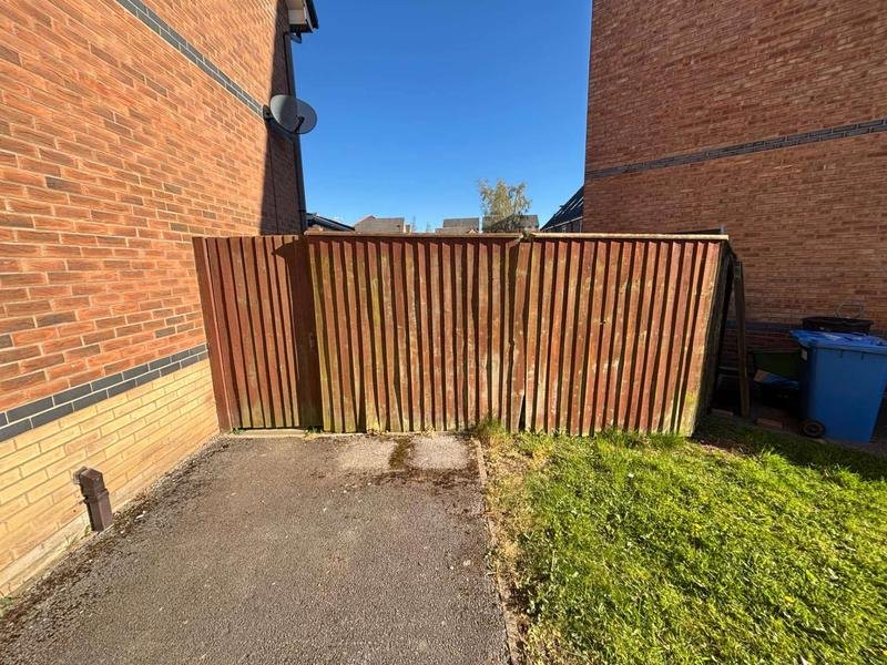 Feather edge fencing with concrete posts and bespoke timber gates in Brymbo, Wrexham