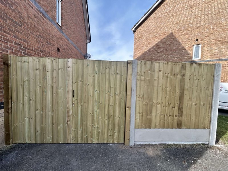 Feather edge fencing with concrete posts and bespoke timber gates in Brymbo, Wrexham
