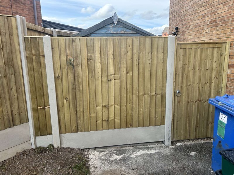 Feather edge fencing with concrete posts and bespoke timber gates in Brymbo, Wrexham