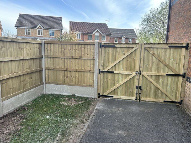 Feather edge fencing with concrete posts and bespoke timber gates in Brymbo, Wrexham