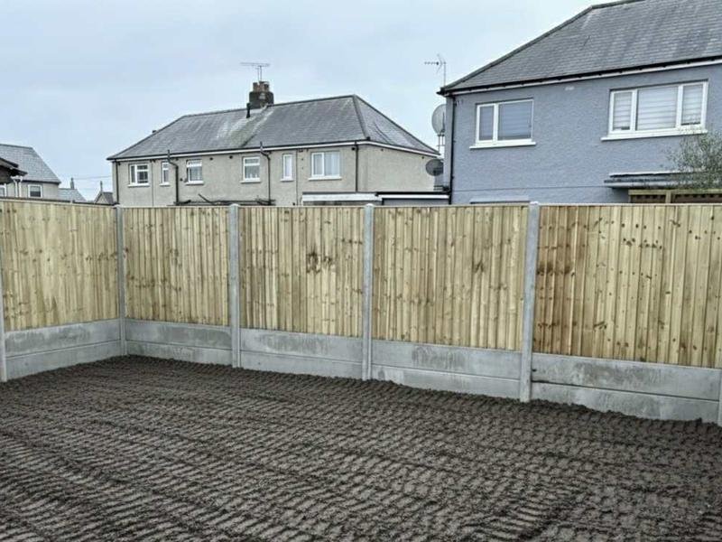 New privacy fencing and a cleared, gravelled garden in New Brighton, Mold
