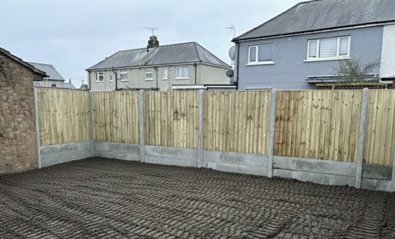 New privacy fencing and a cleared, gravelled garden in New Brighton, Mold