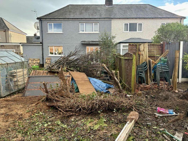New privacy fencing and a cleared, gravelled garden in New Brighton, Mold