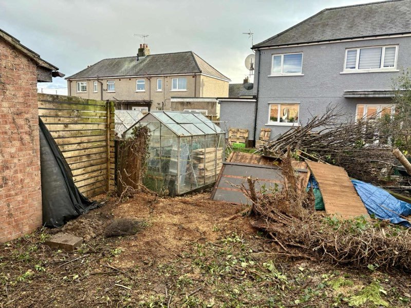 New privacy fencing and a cleared, gravelled garden in New Brighton, Mold