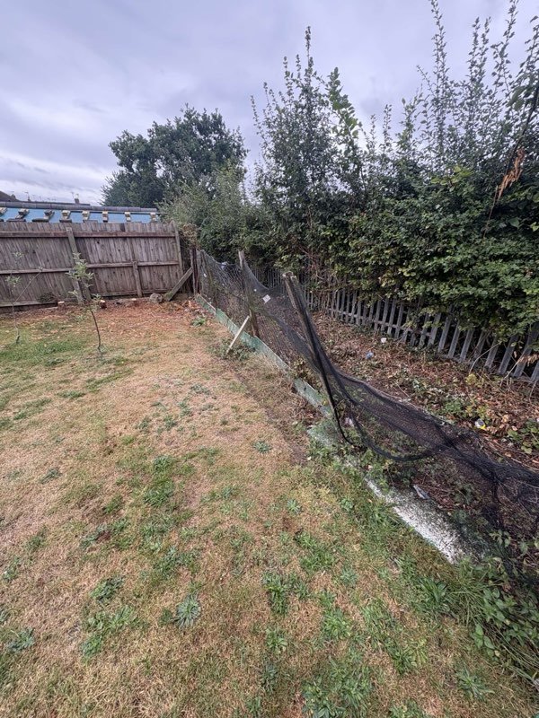 New feather edge rear fence with concrete posts and gravel boards in Bryn Offa, Wrexham