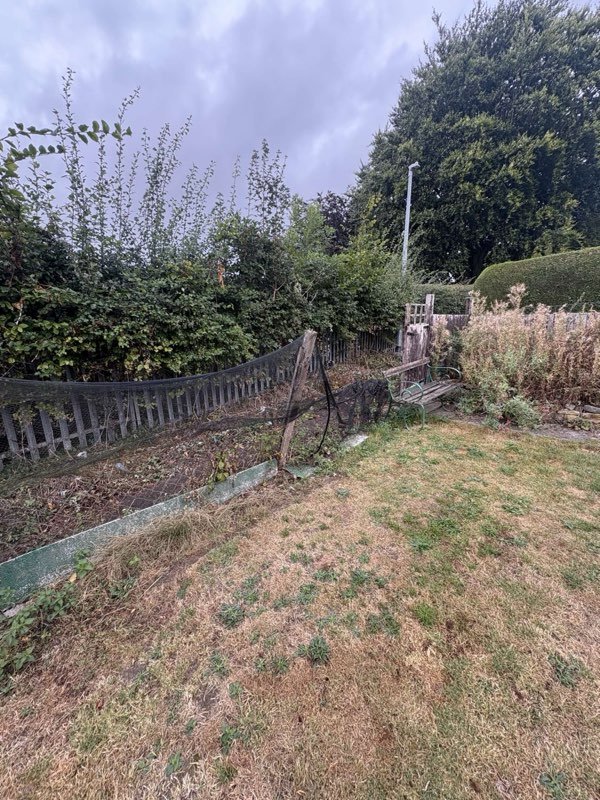 New feather edge rear fence with concrete posts and gravel boards in Bryn Offa, Wrexham