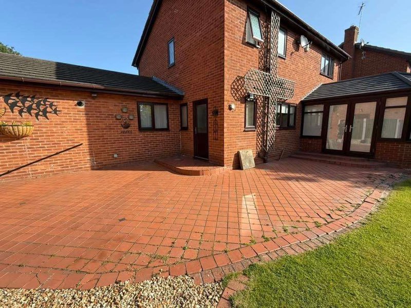 Raj blend Indian sandstone patio with a cobble border in Cross Lanes, Wrexham