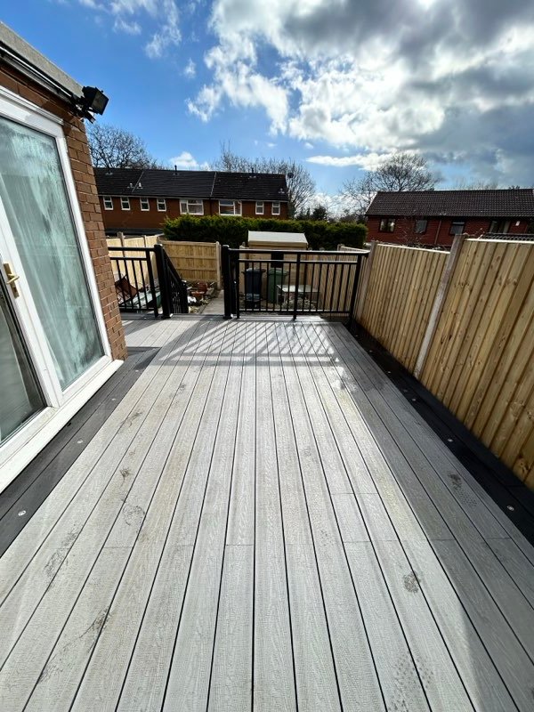 Grey composite decking with aluminium balustrades replacing an old timber deck in Tan-y-Fron, Wrexham