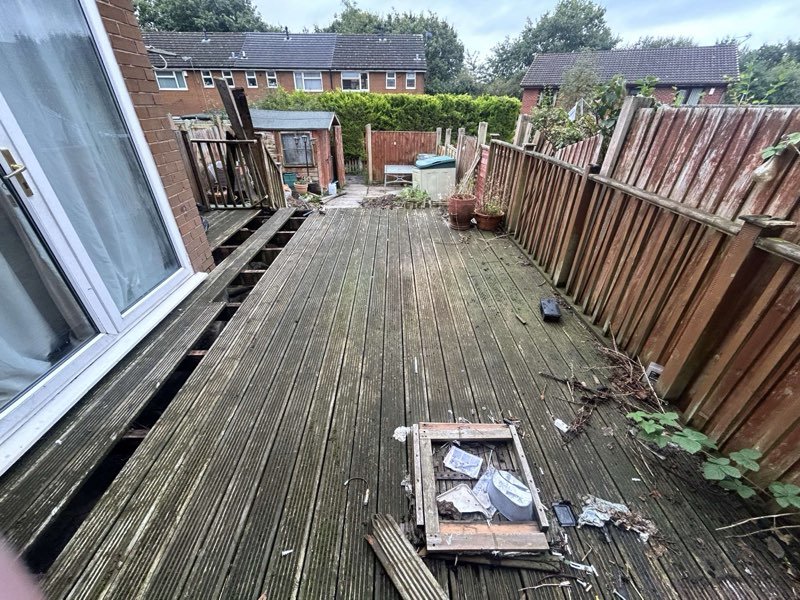 Grey composite decking with aluminium balustrades replacing an old timber deck in Tan-y-Fron, Wrexham