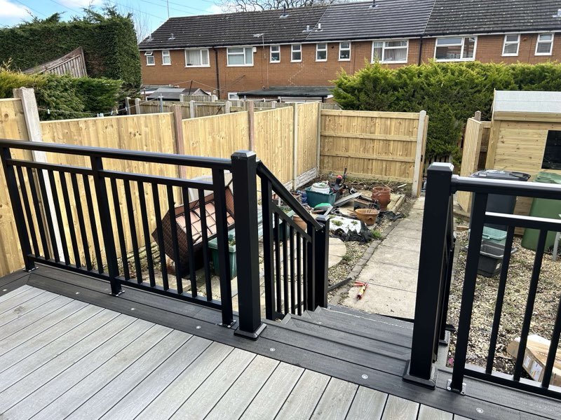 Grey composite decking with aluminium balustrades replacing an old timber deck in Tan-y-Fron, Wrexham