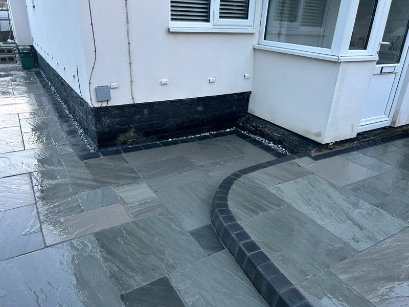 Kandla grey Indian stone patio with charcoal setts and KL kerbs in Bersham, Wrexham