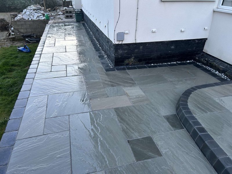Kandla grey Indian stone patio with charcoal setts and KL kerbs in Bersham, Wrexham