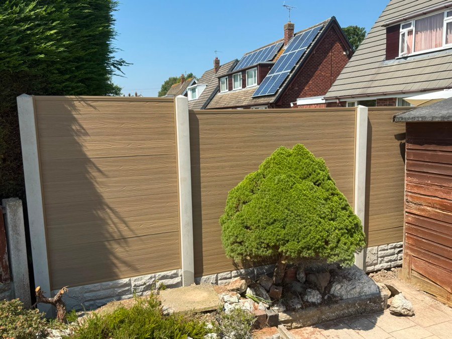 Oak-effect composite fence panels with concrete posts and rock-face gravel boards, installed in Wrexham