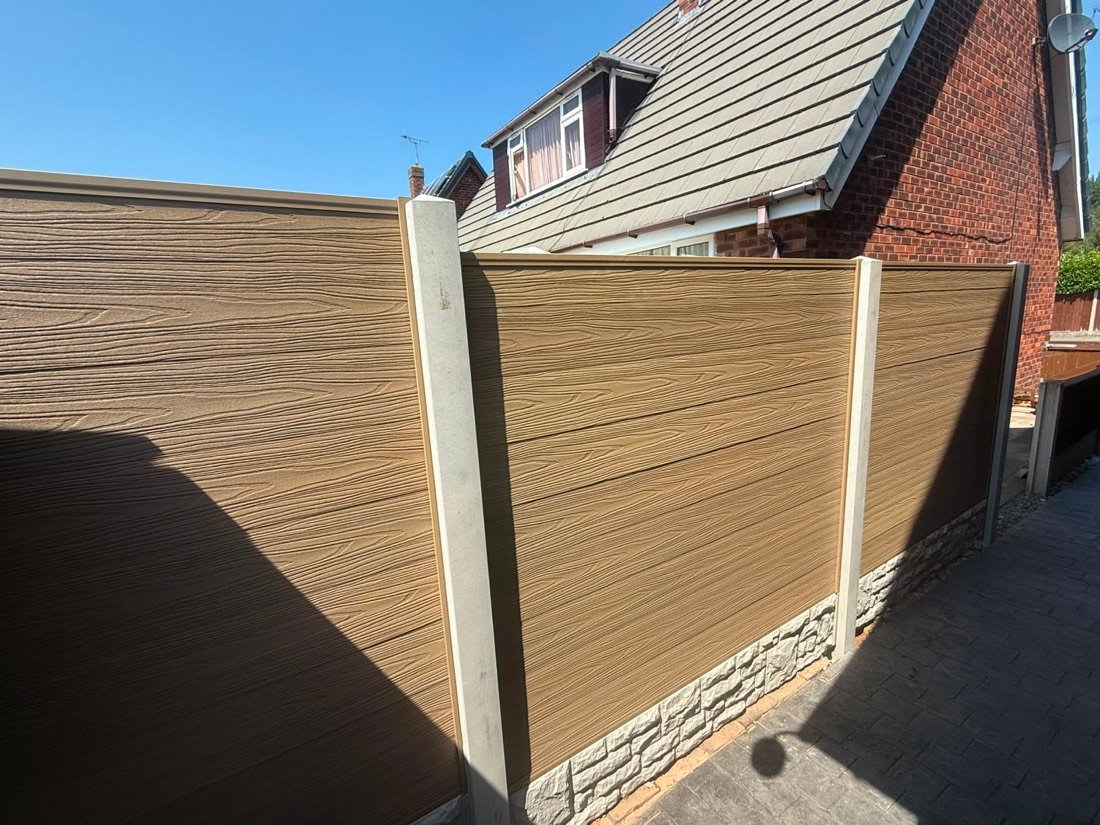 Oak-effect composite fence panels between concrete posts, Wrexham